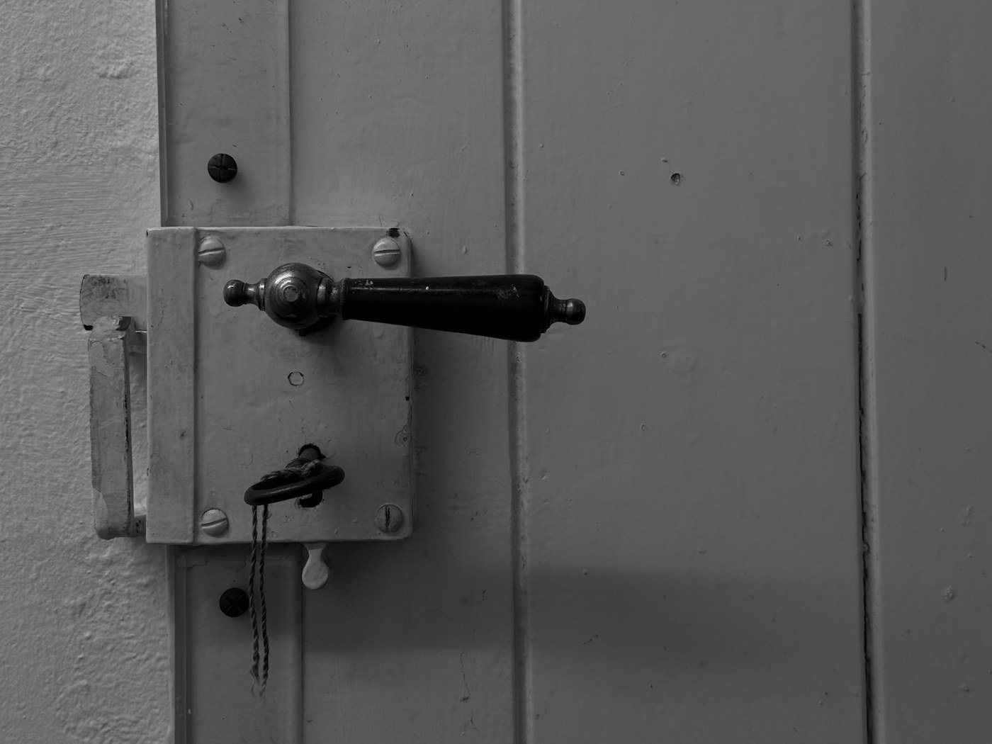 Close-up of a classic door lock, handle, and key